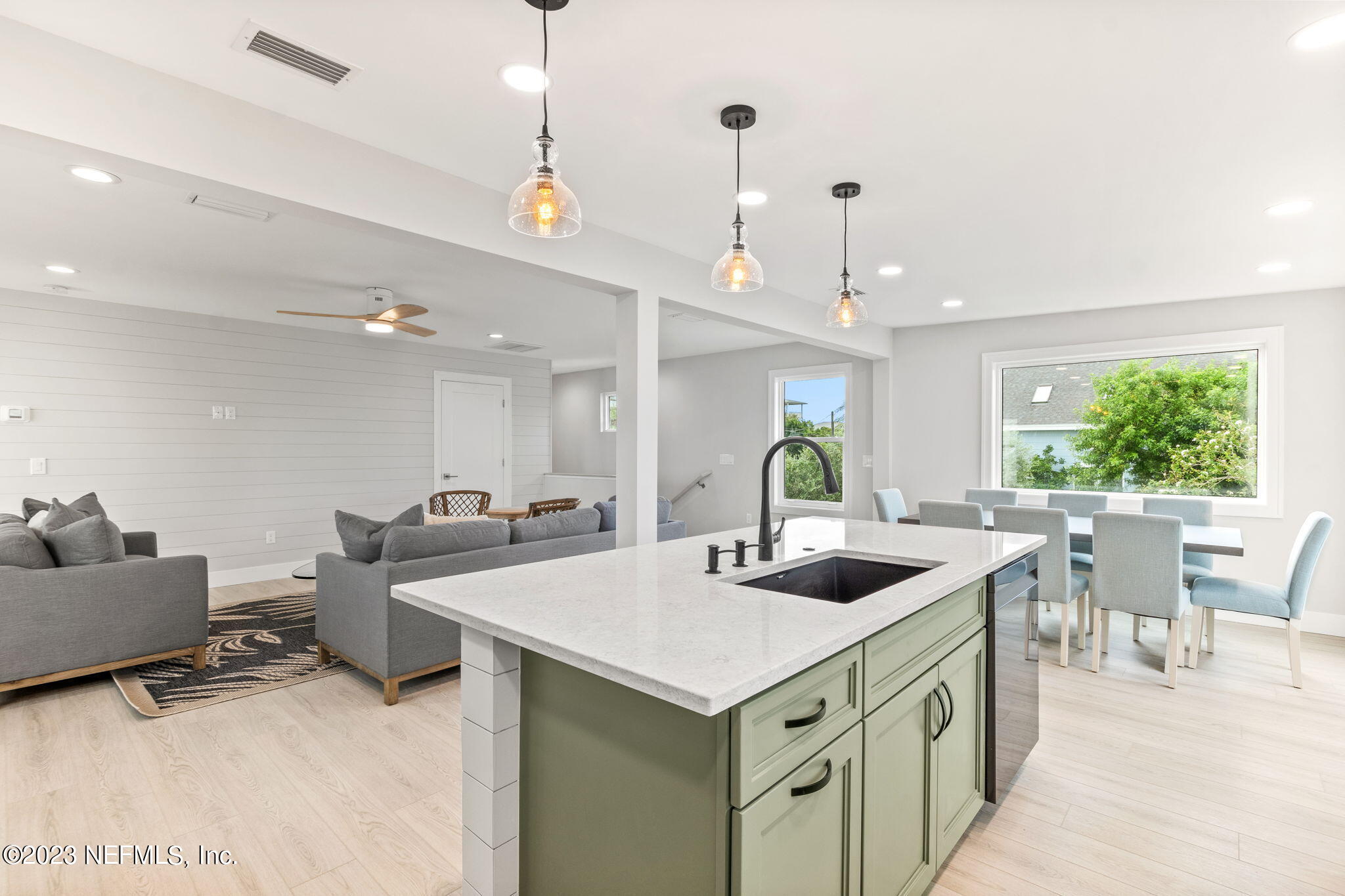 5348 Pelican Way St. Augustine, FL 32080 - Photo 28 of 58 a kitchen with sink and center island