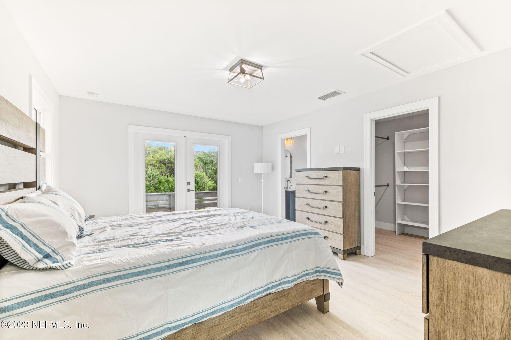 5348 Pelican Way St. Augustine, FL 32080 - Photo 37 of 58 a bedroom with a bed and a flat tv screen