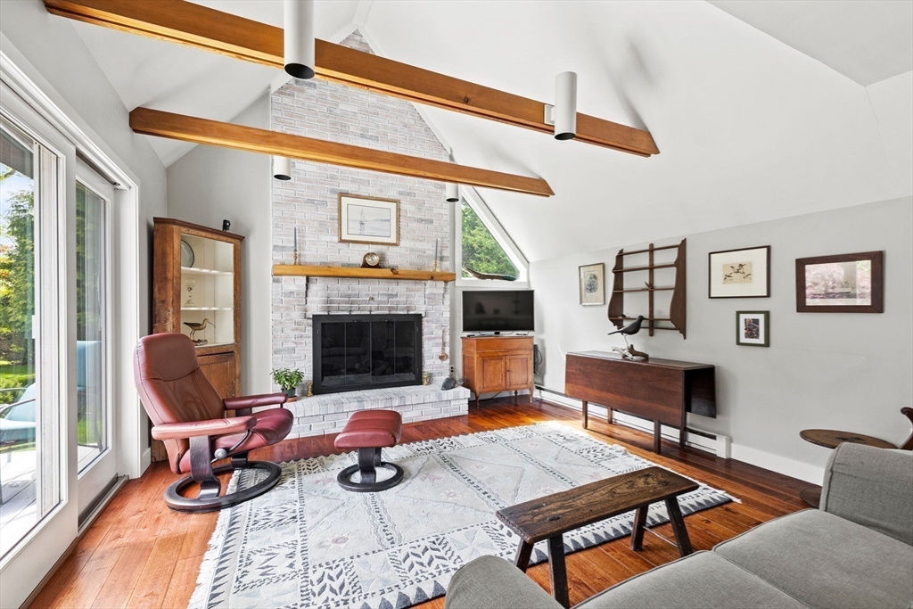 103 Howland Road Westport, MA 02790 - Photo 14 of 35 a living room with furniture a rug and a large window