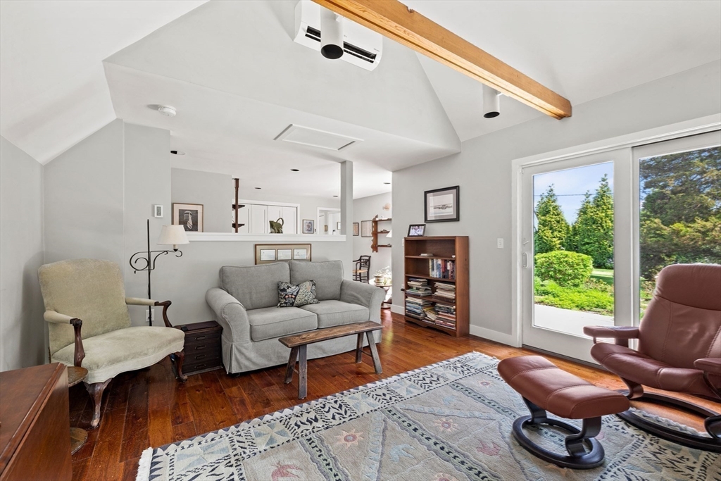 103 Howland Road Westport, MA 02790 - Photo 15 of 35 a living room with furniture fireplace and a large window