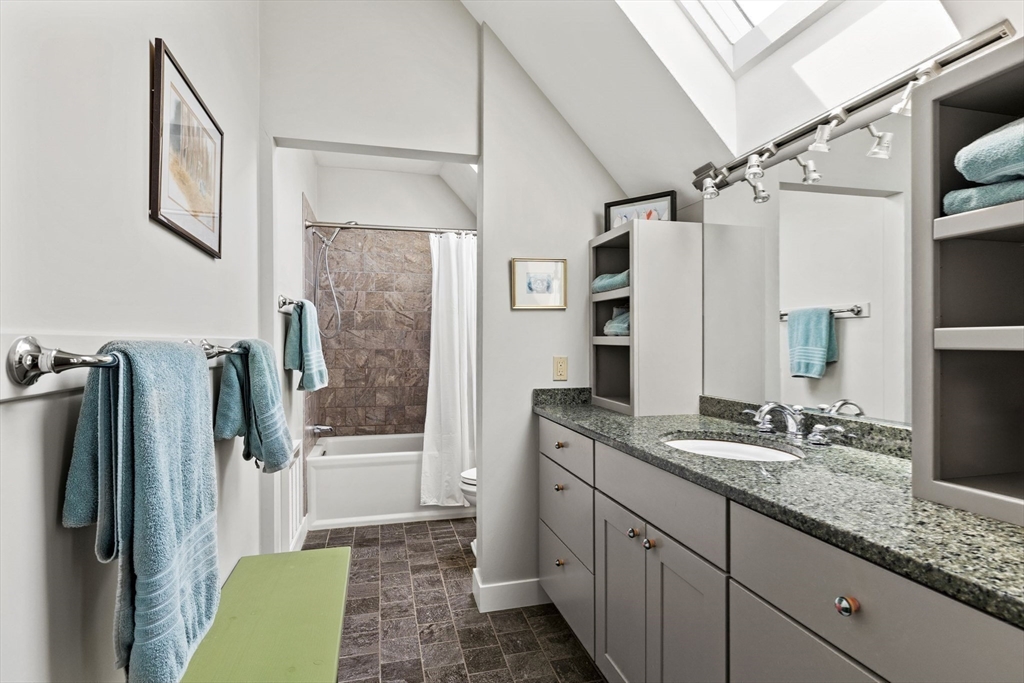 103 Howland Road Westport, MA 02790 - Photo 18 of 35 a bathroom with a double vanity sink and mirror