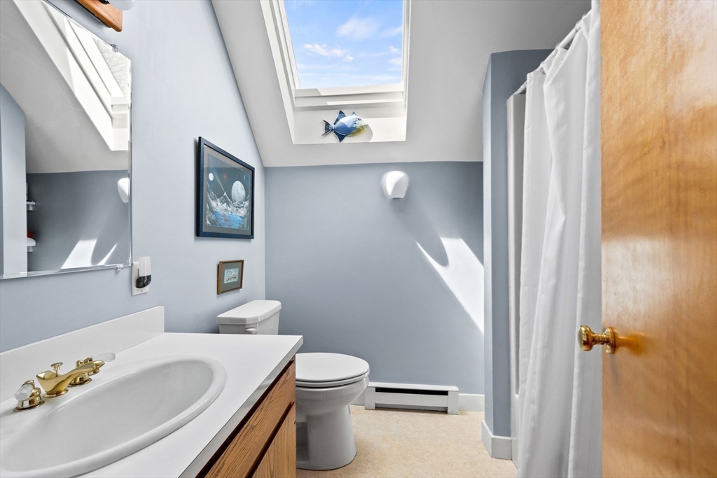 103 Howland Road Westport, MA 02790 - Photo 25 of 35 a bathroom with a sink toilet and shower