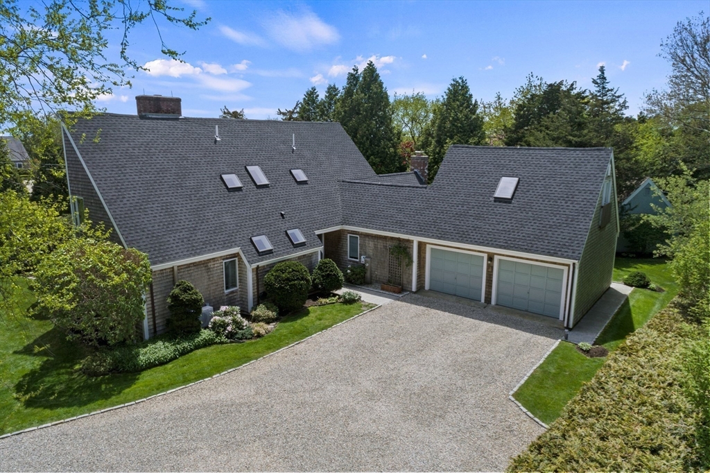 103 Howland Road Westport, MA 02790 - Photo 4 of 35 a aerial view of a house with a yard and potted plants