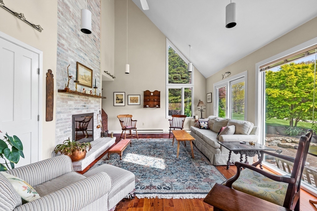 103 Howland Road Westport, MA 02790 - Photo 8 of 35 a living room with furniture fireplace and a large window