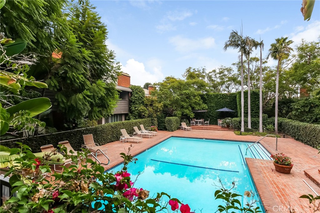 a view of a swimming pool with a patio