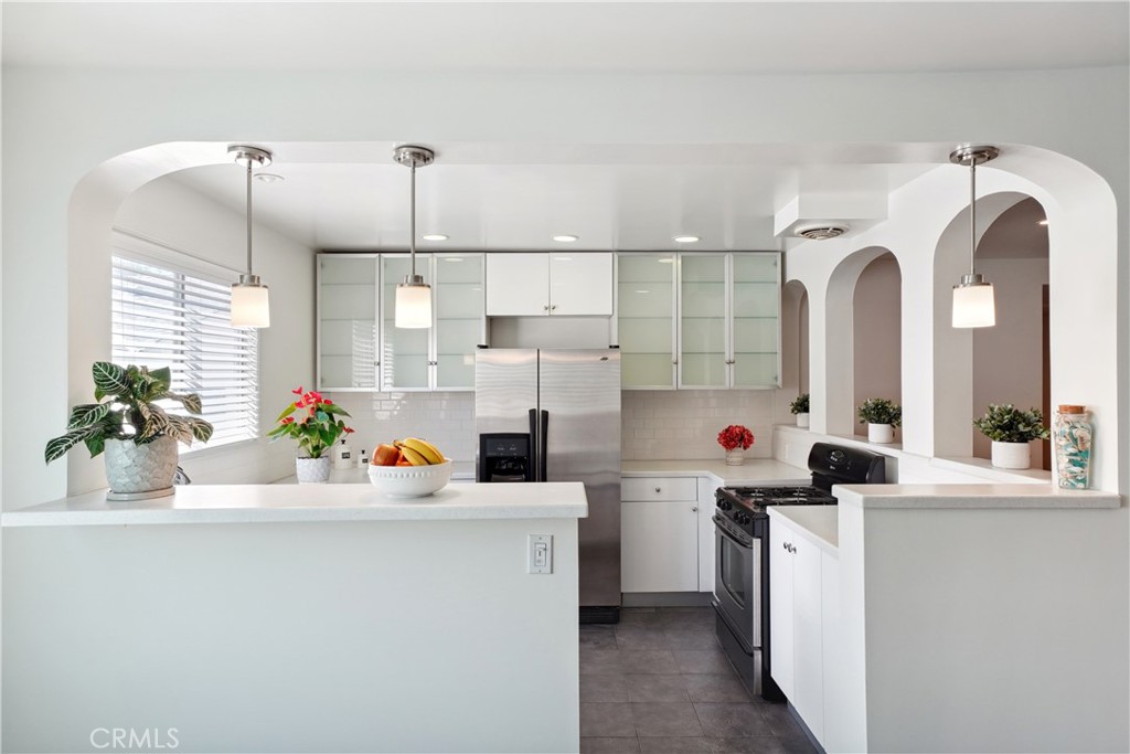 11767 Sunset Boulevard, Unit 202 Los Angeles, CA 90049 - Photo 11 of 22 a view of a kitchen with a sink and dishwasher