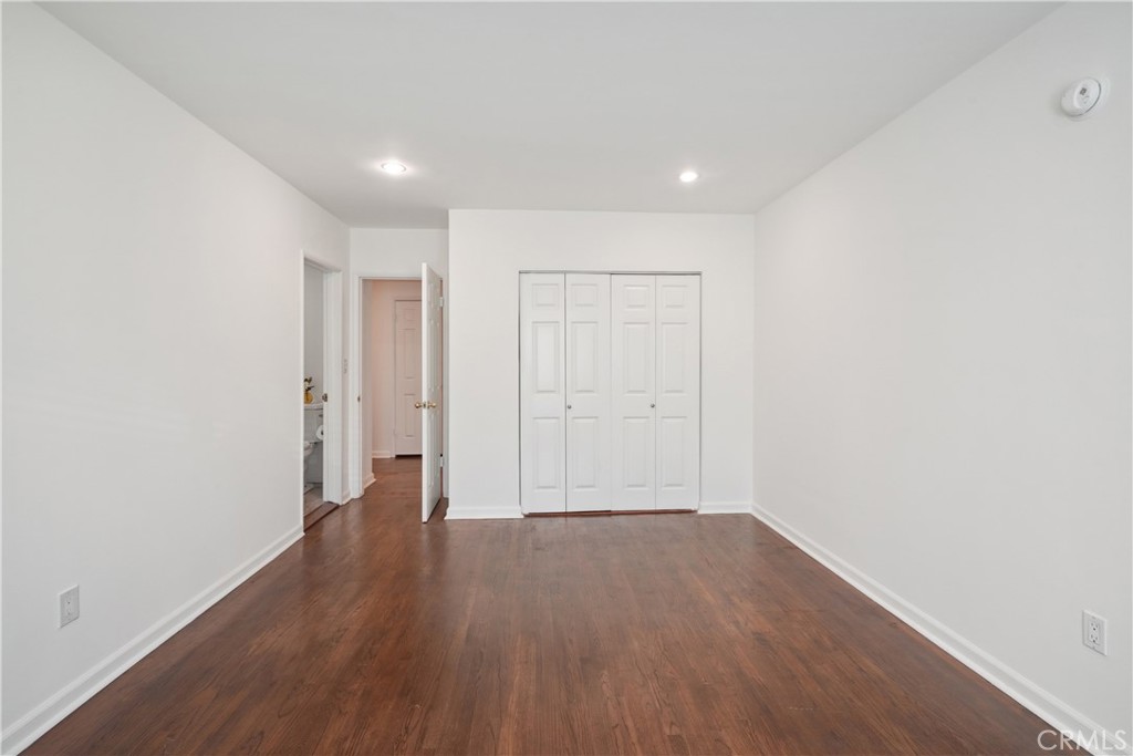 11767 Sunset Boulevard, Unit 202 Los Angeles, CA 90049 - Photo 16 of 22 a view of a room with wooden floor