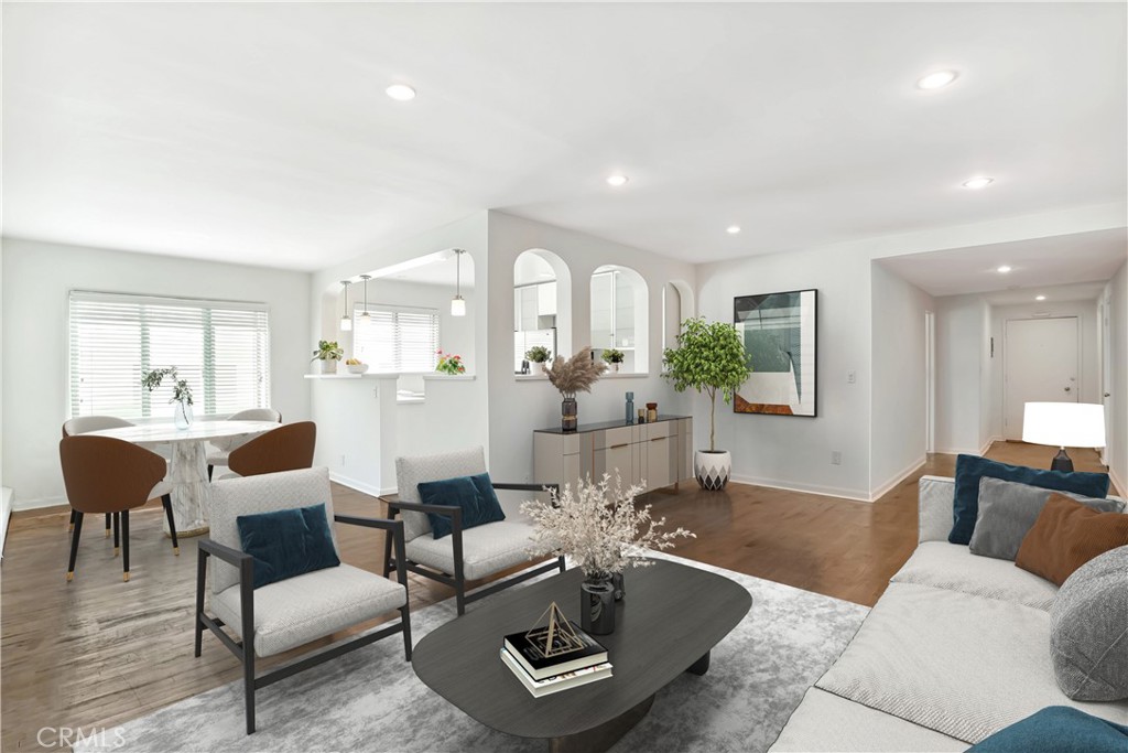 11767 Sunset Boulevard, Unit 202 Los Angeles, CA 90049 - Photo 5 of 22 a living room with furniture and a large window