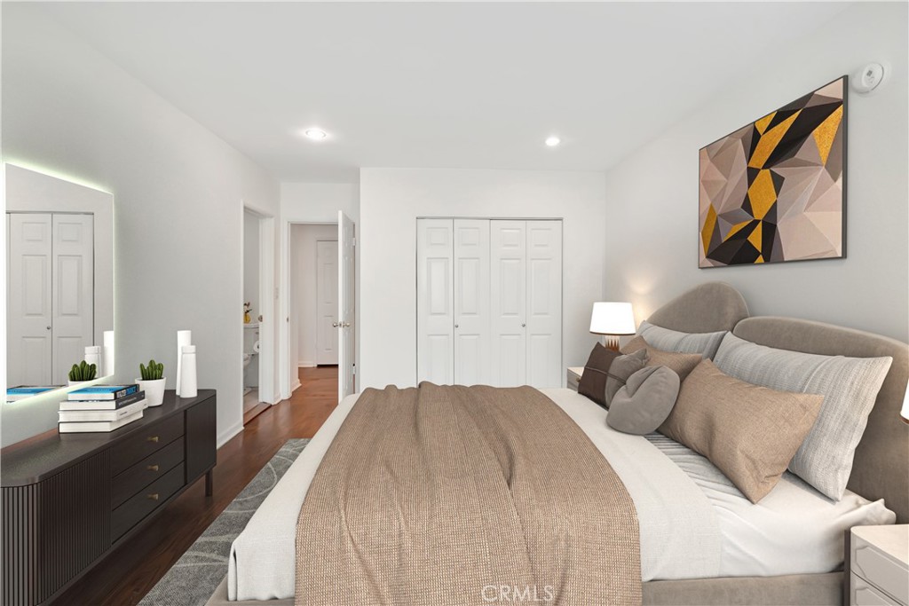 11767 Sunset Boulevard, Unit 202 Los Angeles, CA 90049 - Photo 6 of 22 a spacious bedroom with a large bed and a chandelier