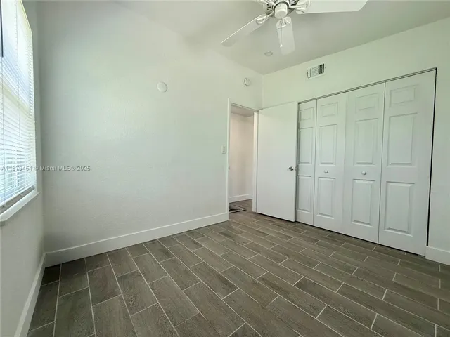 an empty room with a bathroom