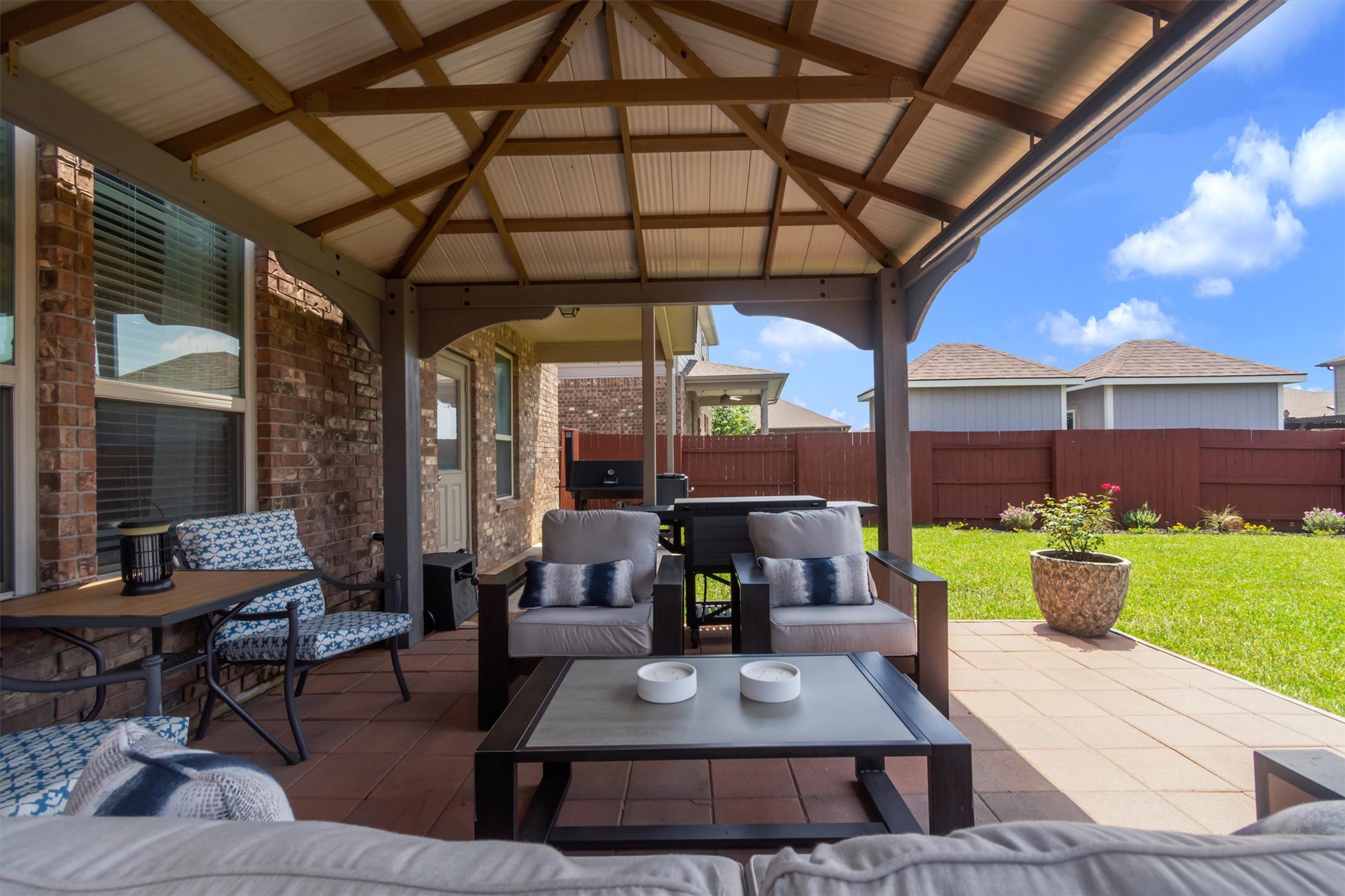 11701 Jackson Falls Way Manor, TX 78653 - Photo 29 of 40 A well-appointed covered patio offers an ideal outdoor living space, perfect for entertaining.
