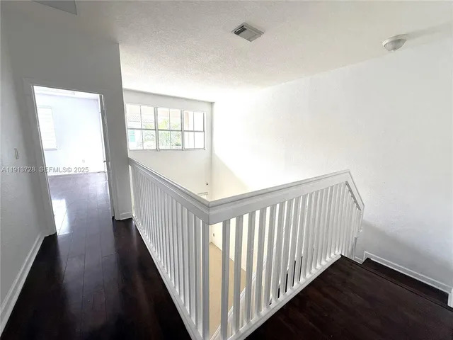 a view of hallway with stairs