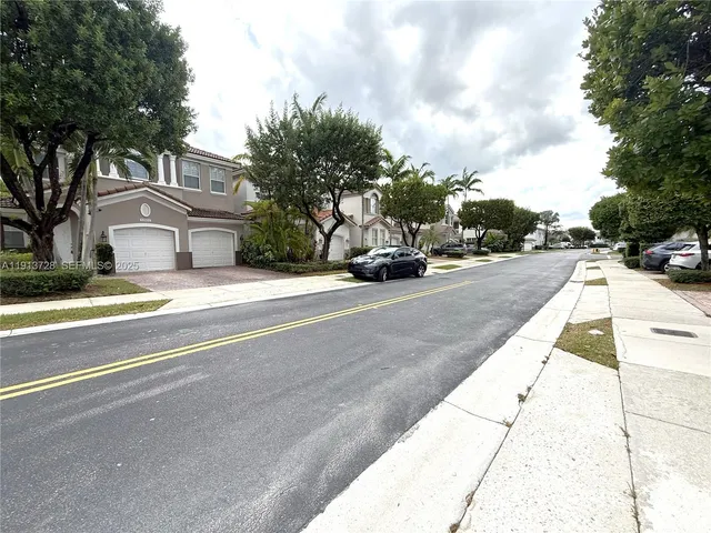 a view of street with parked cars