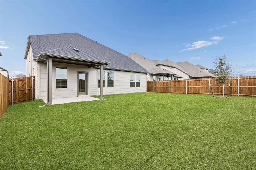 1121 Del Rio Drive Lavon, TX 75166 - Photo 30 of 32 a view of a house with a garden