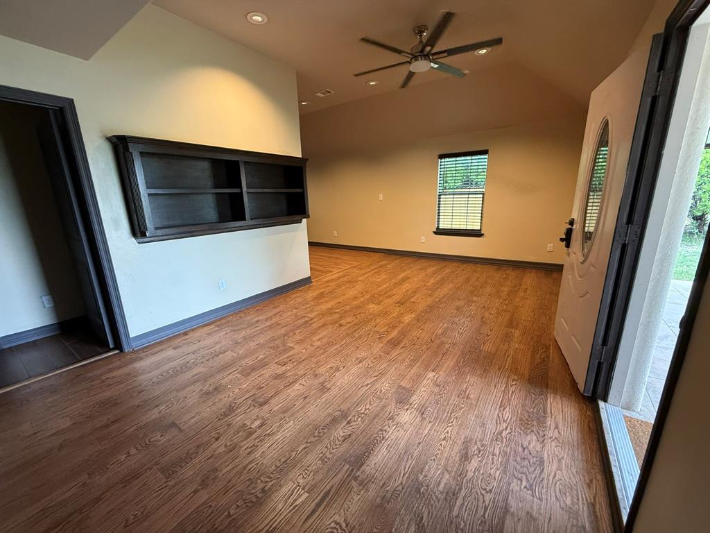3307 Roberts Cut Off Road Lake Worth, TX 76135 - Photo 3 of 14 a view of an empty room with a window and wooden floor