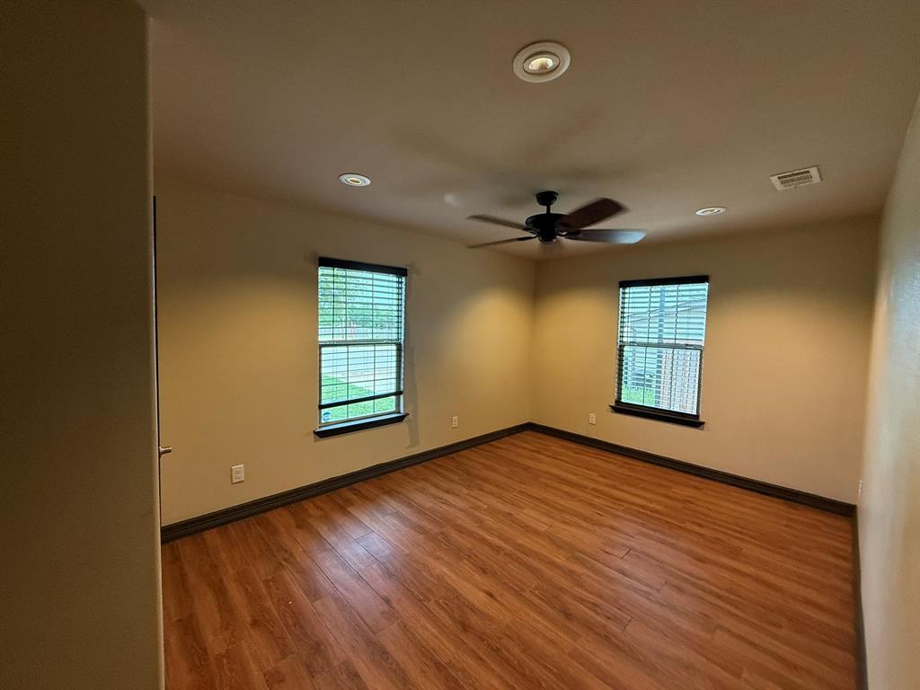 3307 Roberts Cut Off Road Lake Worth, TX 76135 - Photo 6 of 14 a view of an empty room with window and wooden floor