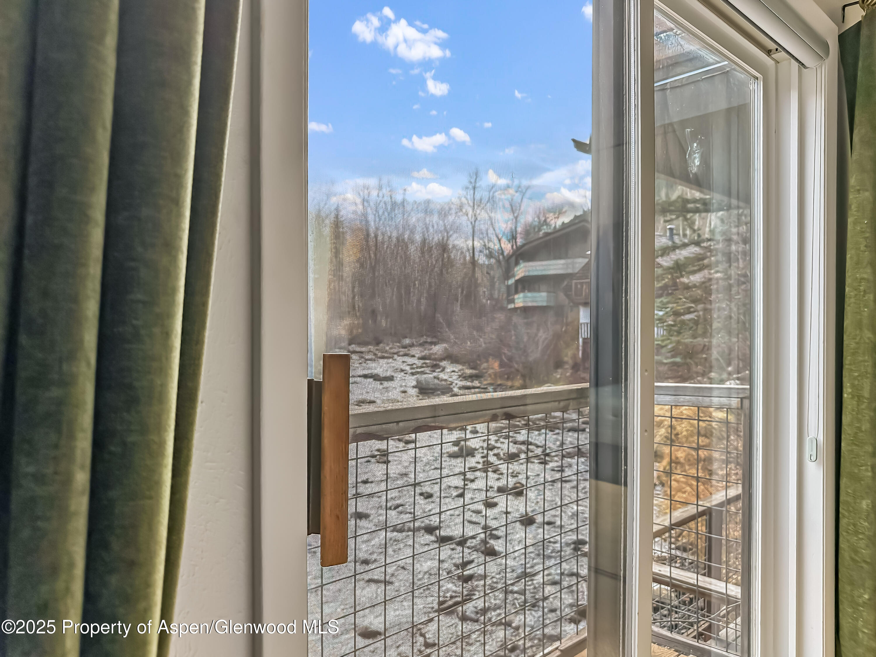 1050 Waters Avenue, Unit 9 Aspen, CO 81611 - Photo 13 of 19 a bathroom with a glass shower door