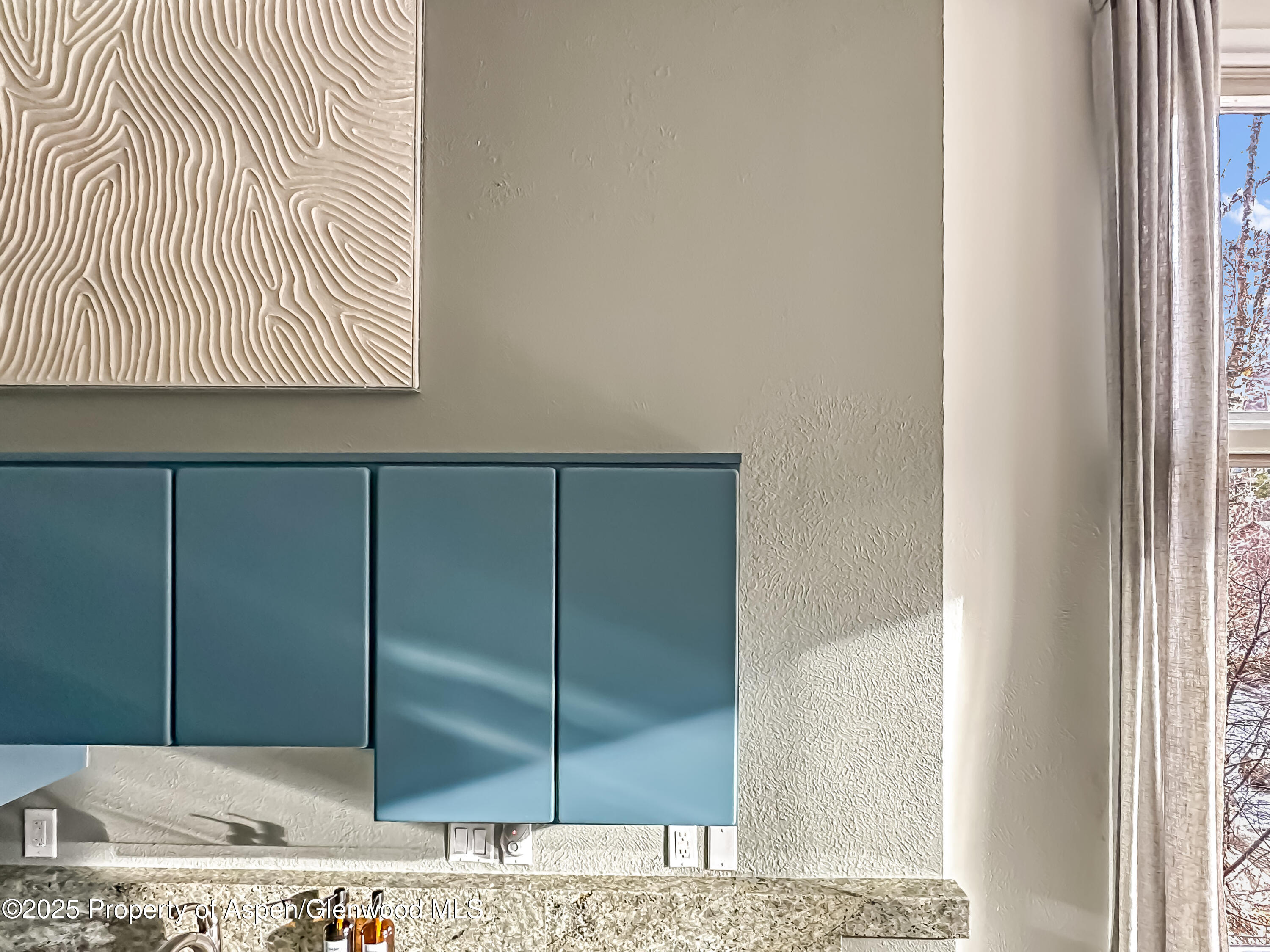 1050 Waters Avenue, Unit 9 Aspen, CO 81611 - Photo 10 of 19 a bathroom with a window