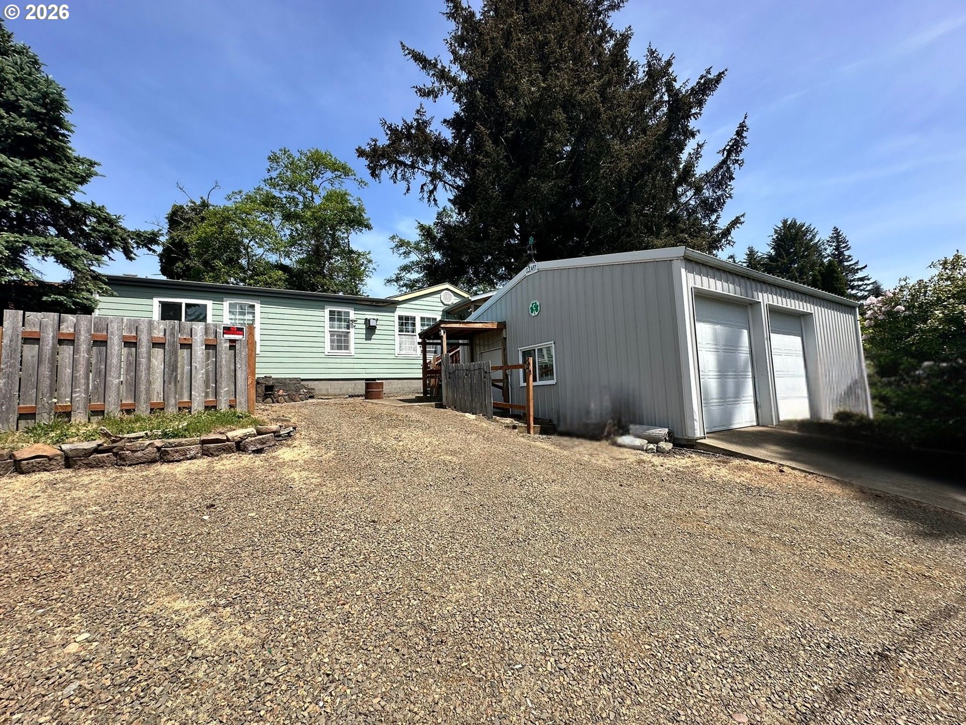 4821 Northeast 50th Street Neotsu, OR 97364 - Photo 1 of 19 a view of a house with backyard and trees