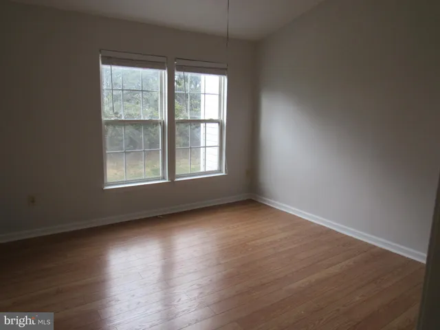 a white toilet sitting next to a shower