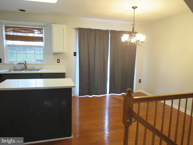 a view of a kitchen from a dining room