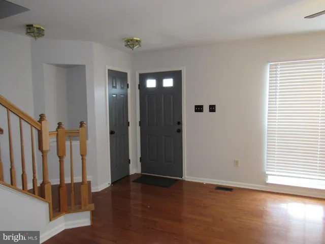a view of entryway with wooden floor
