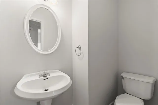 a bathroom with a toilet and a sink