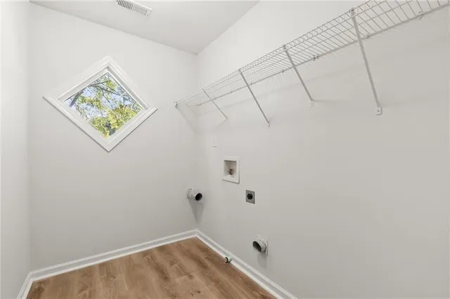 a view of small space with empty racks on the wall