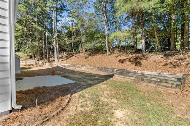 a view of a yard with trees