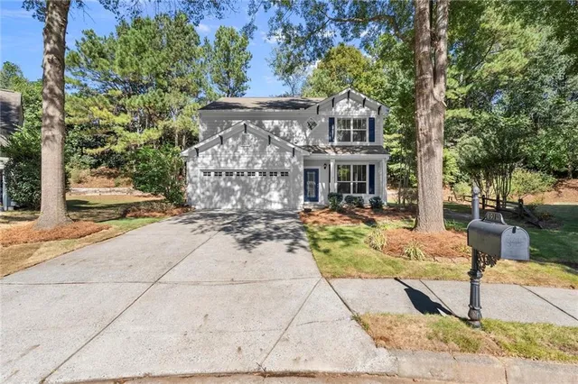 a front view of a house with a pathway