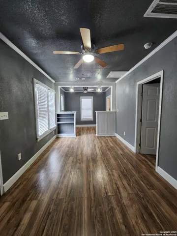 a view of a room wooden floor and staircase