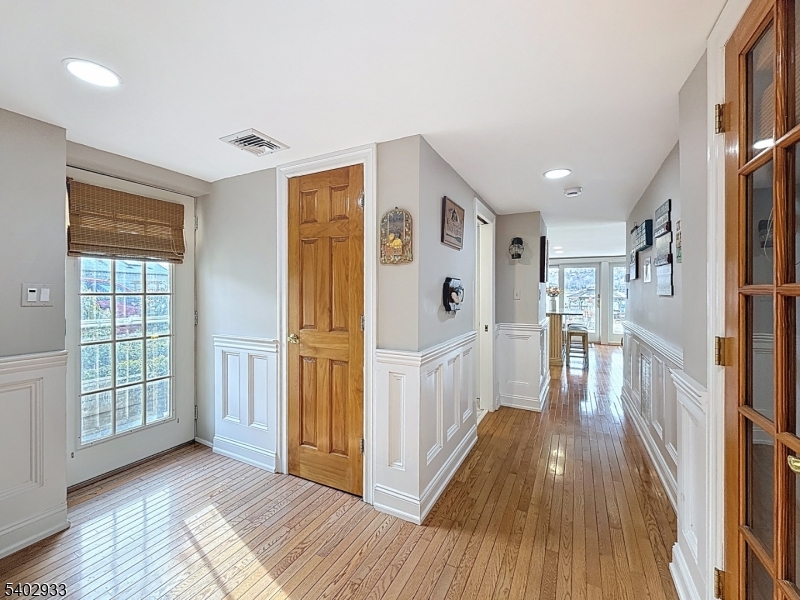96 East Shore Trail Sparta, NJ 07871 - Photo 25 of 44 a view of a hallway with wooden floor and staircase
