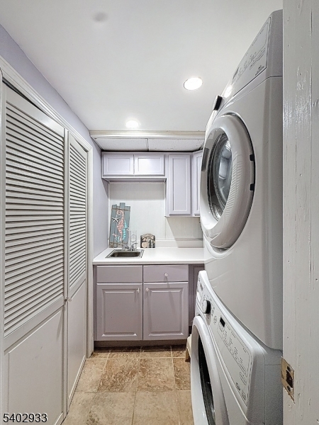 96 East Shore Trail Sparta, NJ 07871 - Photo 29 of 44 a kitchen with a sink a washer and dryer