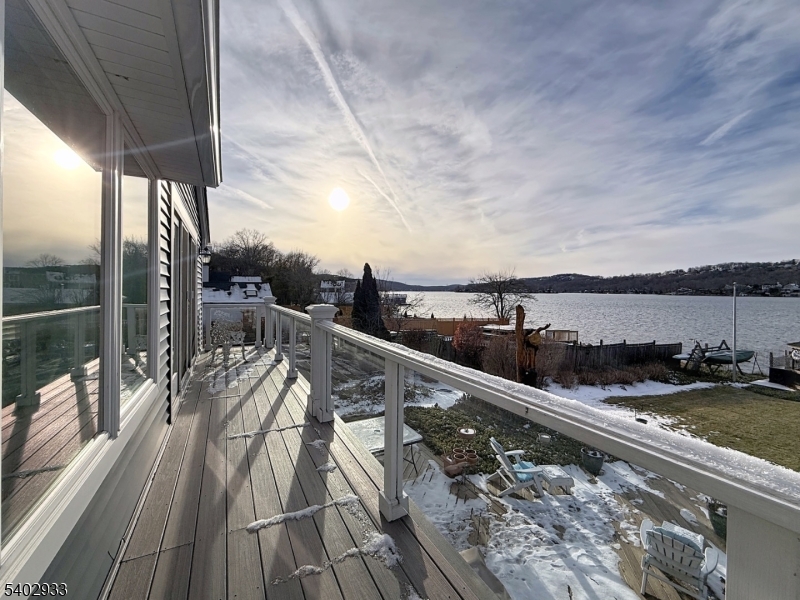 96 East Shore Trail Sparta, NJ 07871 - Photo 42 of 44 a view of a balcony with wooden floor and iron stairs