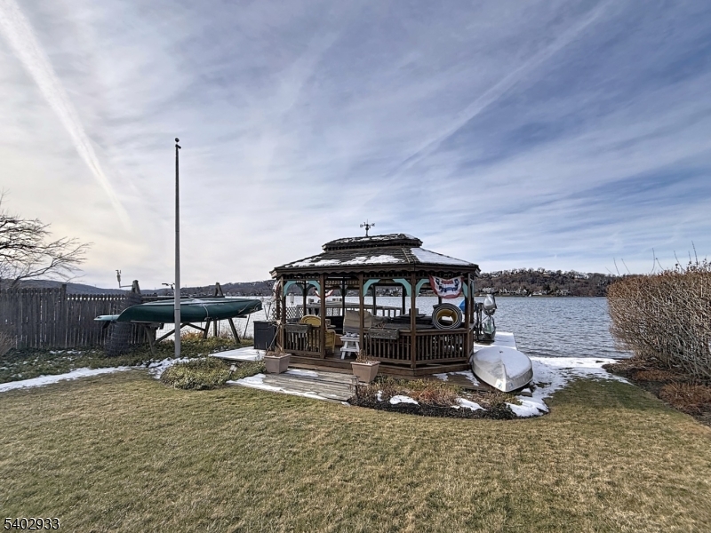 96 East Shore Trail Sparta, NJ 07871 - Photo 7 of 44 a view of a house with a yard and sitting area