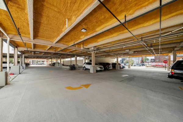 a view of a room with wooden floor and a window