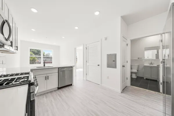 a bathroom with a toilet a sink and bathtub