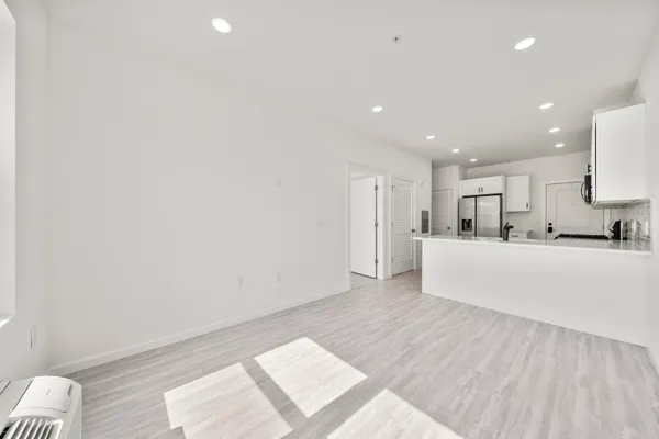 a kitchen with cabinets stainless steel appliances and a sink