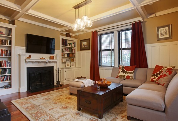 34 Garrison Road, Unit 2 Brookline, MA 02445 - Photo 1 of 7 a living room with furniture a flat screen tv and a fireplace