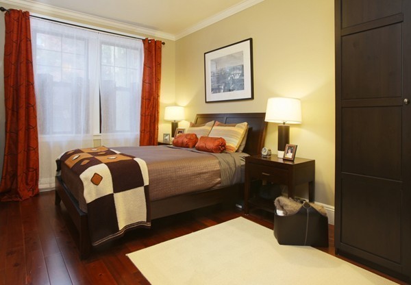 34 Garrison Road, Unit 2 Brookline, MA 02445 - Photo 5 of 7 a bedroom with a bed and wooden floor