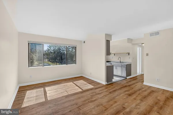 a view of kitchen with wooden floor