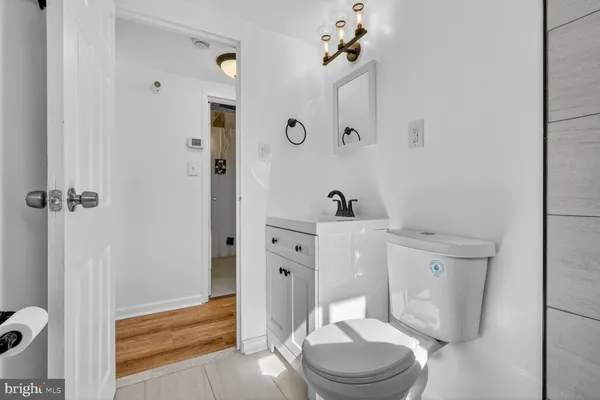 a white toilet sitting next to a bathroom sink
