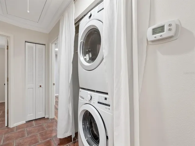 a view of a hallway with washer and dryer