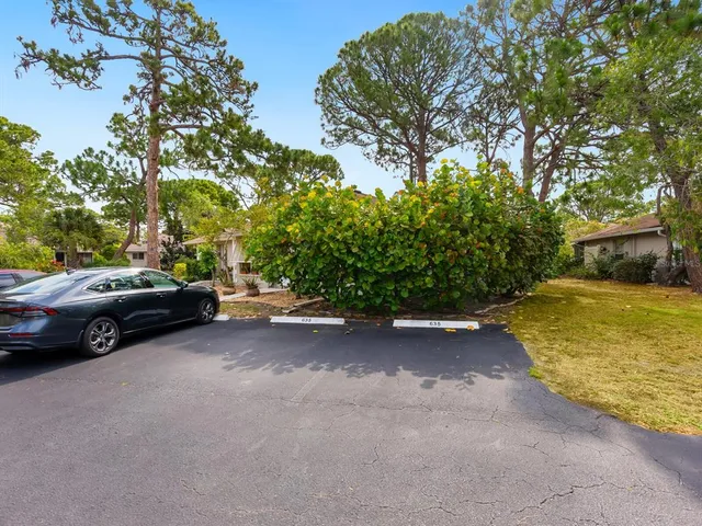 a view of a street with a parked cars