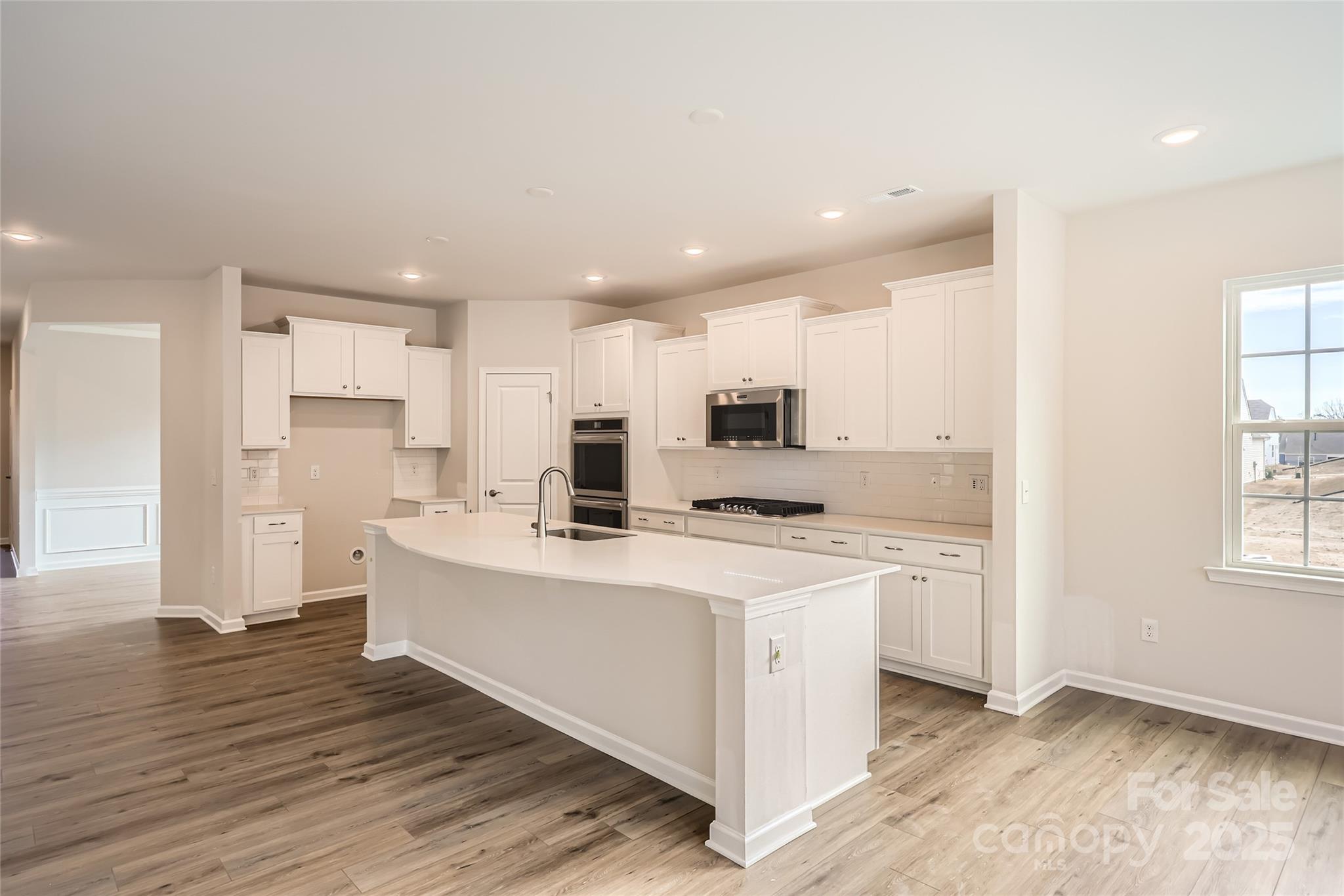 5932 Oak Br Circle Maiden, NC 28650 - Photo 5 of 13 a large kitchen with stainless steel appliances a sink a stove a refrigerator and cabinets