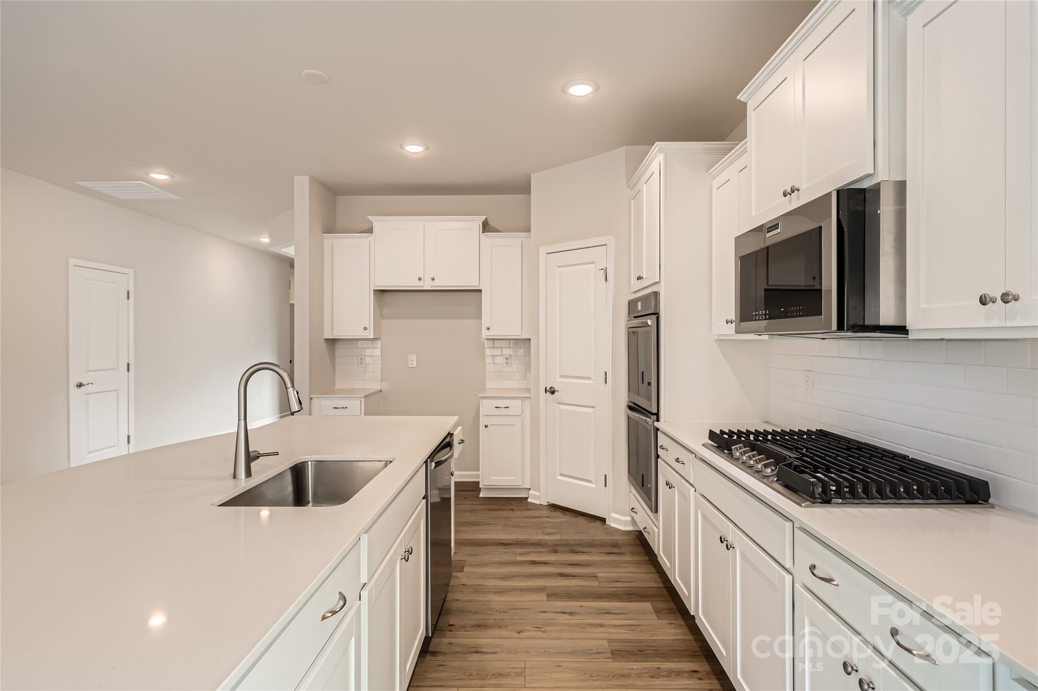 5932 Oak Br Circle Maiden, NC 28650 - Photo 6 of 13 a kitchen with stainless steel appliances a sink a stove and a refrigerator