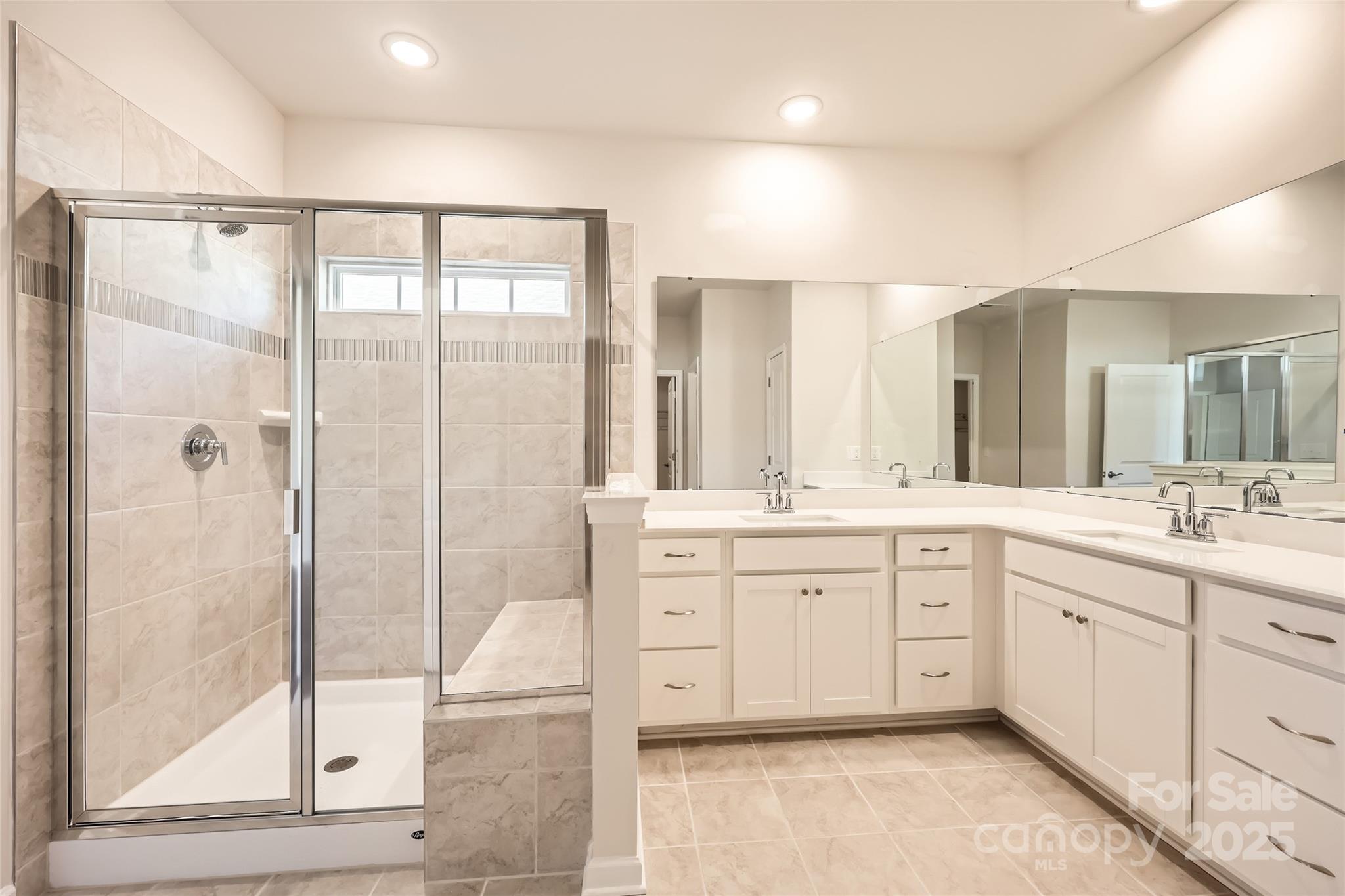 5932 Oak Br Circle Maiden, NC 28650 - Photo 8 of 13 a spacious bathroom with a shower sink and mirror