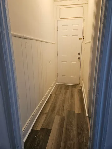 a view of wooden floor and windows in a room