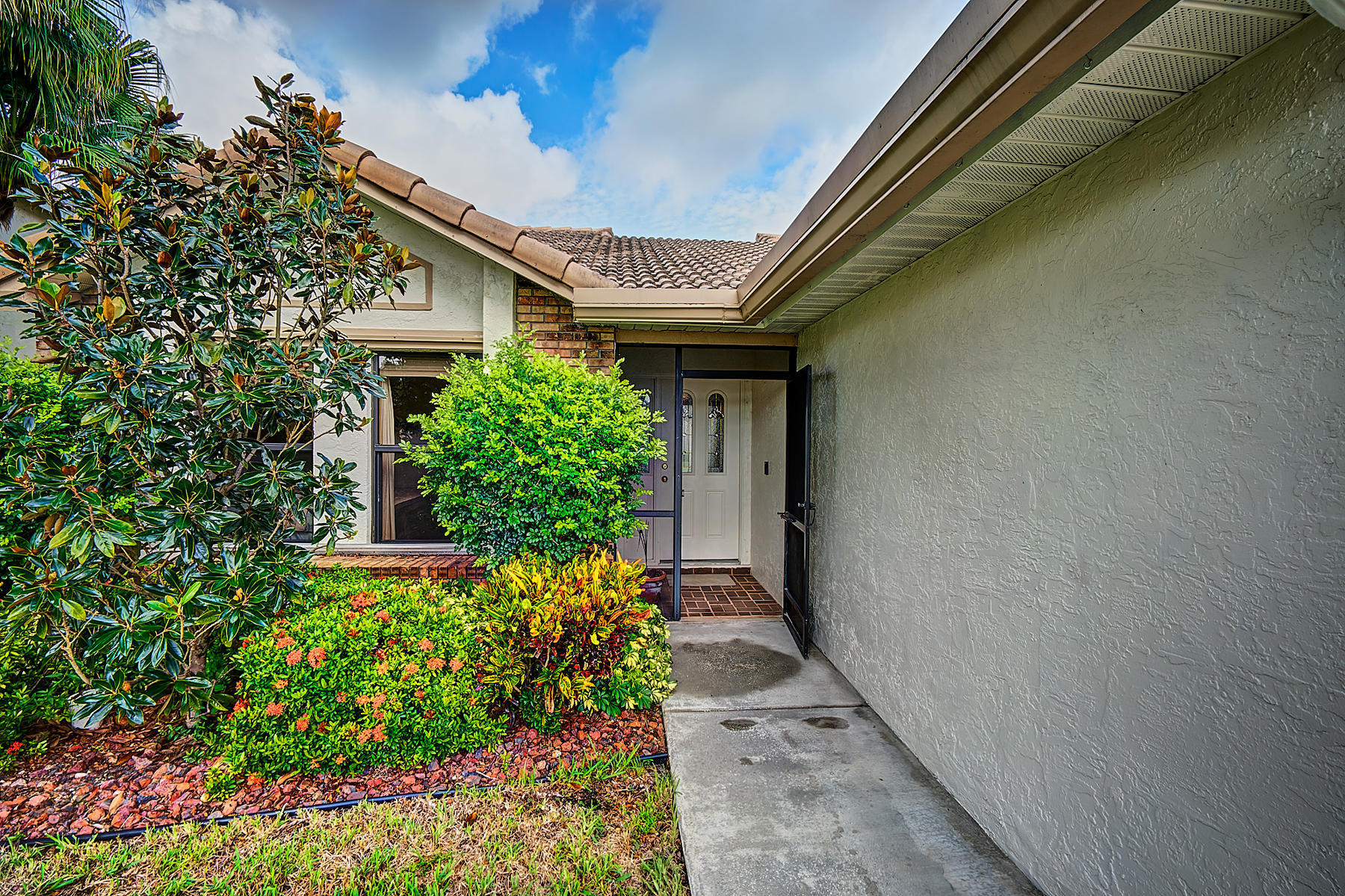 10404 Islander Drive Boca Raton, FL 33498 - Photo 2 of 44 Front Screened Entrance