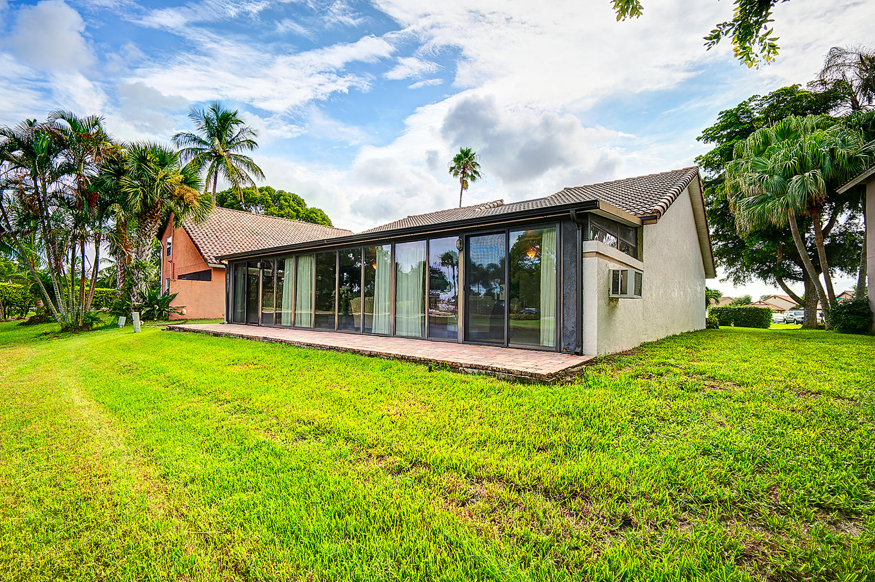 10404 Islander Drive Boca Raton, FL 33498 - Photo 32 of 44 Exterior Enclosed Hurricane Glass Patio